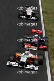 01.08.2010 Budapest, Hungary,  Vitantonio Liuzzi (ITA), Force India F1 Team, VJM-03 leads Jenson Button (GBR), McLaren Mercedes, MP4-25 - Formula 1 World Championship, Rd 12, Hungarian Grand Prix, Sunday Race