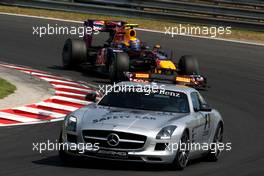 01.08.2010 Budapest, Hungary,  The safety car leads Mark Webber (AUS), Red Bull Racing, RB6 - Formula 1 World Championship, Rd 12, Hungarian Grand Prix, Sunday Race