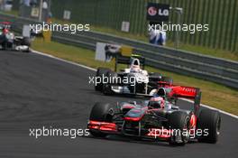 01.08.2010 Budapest, Hungary,  Jenson Button (GBR), McLaren Mercedes leads Kamui Kobayashi (JAP), BMW Sauber F1 Team - Formula 1 World Championship, Rd 12, Hungarian Grand Prix, Sunday Race