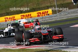 01.08.2010 Budapest, Hungary,  Jenson Button (GBR), McLaren Mercedes leads Kamui Kobayashi (JAP), BMW Sauber F1 Team - Formula 1 World Championship, Rd 12, Hungarian Grand Prix, Sunday Race