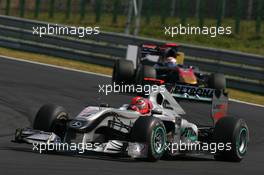 01.08.2010 Budapest, Hungary,  Michael Schumacher (GER), Mercedes GP Petronas leads Sébastien Buemi (SUI), Scuderia Toro Rosso - Formula 1 World Championship, Rd 12, Hungarian Grand Prix, Sunday Race