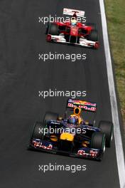 01.08.2010 Budapest, Hungary,  Mark Webber (AUS), Red Bull Racing, RB6 leads Felipe Massa (BRA), Scuderia Ferrari, F10 - Formula 1 World Championship, Rd 12, Hungarian Grand Prix, Sunday Race