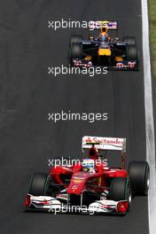 01.08.2010 Budapest, Hungary,  Fernando Alonso (ESP), Scuderia Ferrari leads Mark Webber (AUS), Red Bull Racing, RB6 - Formula 1 World Championship, Rd 12, Hungarian Grand Prix, Sunday Race