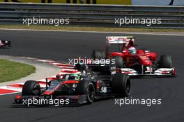 01.08.2010 Budapest, Hungary,  Sakon Yamamoto (JPN), Hispania Racing F1 Team HRT leads Fernando Alonso (ESP), Scuderia Ferrari, F10 - Formula 1 World Championship, Rd 12, Hungarian Grand Prix, Sunday Race