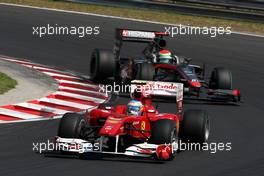 01.08.2010 Budapest, Hungary,  Fernando Alonso (ESP), Scuderia Ferrari, F10 leads Sakon Yamamoto (JPN), Hispania Racing F1 Team HRT - Formula 1 World Championship, Rd 12, Hungarian Grand Prix, Sunday Race