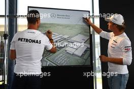 29.07.2010 Budapest, Hungary,  Nico Rosberg (GER), Mercedes GP Petronas and Michael Schumacher (GER), Mercedes GP Petronas visit a Mercedes Garage and plans for expansion  - Formula 1 World Championship, Rd 12, Hungarian Grand Prix, Thursday Press Conference