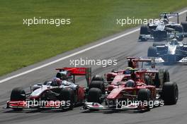 12.09.2010 Monza, Italy,  Start of the race, Jenson Button (GBR), McLaren Mercedes and Fernando Alonso (ESP), Scuderia Ferrari  - Formula 1 World Championship, Rd 14, Italian Grand Prix, Sunday Race