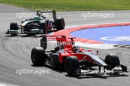 12.09.2010 Monza, Italy,  Timo Glock (GER), Virgin Racing VR-01 leads Heikki Kovalainen (FIN), Lotus F1 Team - Formula 1 World Championship, Rd 14, Italian Grand Prix, Sunday Race