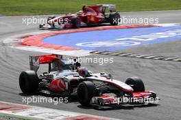 12.09.2010 Monza, Italy,  Jenson Button (GBR), McLaren Mercedes, MP4-25 leads Fernando Alonso (ESP), Scuderia Ferrari, F10 - Formula 1 World Championship, Rd 14, Italian Grand Prix, Sunday Race