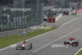 12.09.2010 Monza, Italy,  Fernando Alonso (ESP), Scuderia Ferrari overtake Jenson Button (GBR), McLaren Mercedes  - Formula 1 World Championship, Rd 14, Italian Grand Prix, Sunday Race