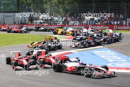 12.09.2010 Monza, Italy,  Jenson Button (GBR), McLaren Mercedes leads the start of the race - Formula 1 World Championship, Rd 14, Italian Grand Prix, Sunday Race