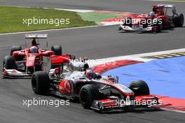 12.09.2010 Monza, Italy,  Jenson Button (GBR), McLaren Mercedes, MP4-25 leads Fernando Alonso (ESP), Scuderia Ferrari - Formula 1 World Championship, Rd 14, Italian Grand Prix, Sunday Race