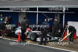 13.02.2010 Jerez, Spain,  Michael Schumacher (GER), Mercedes GP Petronas pit stop practice - Formula 1 Testing, Jerez, Spain