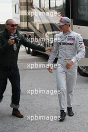 11.02.2010 Jerez, Spain,  Michel Comte (photographer) with Michael Schumacher (GER), Mercedes GP - Formula 1 Testing, Jerez, Spain