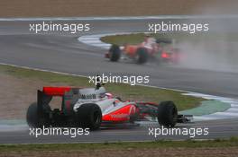 10.02.2010 Jerez, Spain,  Jenson Button (GBR), McLaren Mercedes, MP4-25 follows Fernando Alonso (ESP), Scuderia Ferrari - Formula 1 Testing, Jerez, Spain