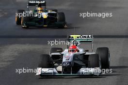 17.02.2010 Jerez, Spain,  Michael Schumacher (GER), Mercedes GP Petronas, W01 leads Fairuz Fauzy (MAL), Test Driver, Lotus F1 Team- Formula 1 Testing, Jerez, Spain