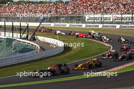 10.10.2010 Suzuka, Japan,  Sebastian Vettel (GER), Red Bull Racing leads the start of the race - Formula 1 World Championship, Rd 16, Japanese Grand Prix, Sunday Race