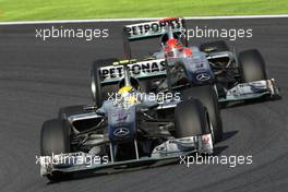 10.10.2010 Suzuka, Japan,  Michael Schumacher (GER), Mercedes GP and Michael Schumacher (GER), Mercedes GP  - Formula 1 World Championship, Rd 16, Japanese Grand Prix, Sunday Race