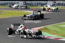 10.10.2010 Suzuka, Japan,  Michael Schumacher (GER), Mercedes GP Petronas, W01 leads Nick Heidfeld (GER), BMW Sauber F1 Team- Formula 1 World Championship, Rd 16, Japanese Grand Prix, Sunday Race