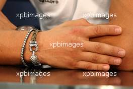 07.10.2010 Suzuka, Japan,  The bracelet of Michael Schumacher (GER), Mercedes GP Petronas - Formula 1 World Championship, Rd 16, Japanese Grand Prix, Thursday Press Conference