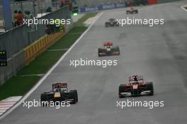 24.10.2010 Yeongam, Korea,  Sebastian Vettel (GER), Red Bull Racing is passed by Fernando Alonso (ESP), Scuderia Ferrari as he retires from the race - Formula 1 World Championship, Rd 17, Korean Grand Prix, Sunday Race
