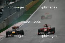 24.10.2010 Yeongam, Korea,  Sebastian Vettel (GER), Red Bull Racing is passed by Fernando Alonso (ESP), Scuderia Ferrari as he retires from the race - Formula 1 World Championship, Rd 17, Korean Grand Prix, Sunday Race