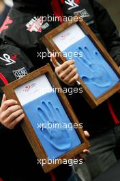 23.10.2010 Yeongam, Korea,  Timo Glock (GER), Virgin Racing and Lucas di Grassi (BRA), Virgin Racing, hand printing session - Formula 1 World Championship, Rd 17, Korean Grand Prix, Saturday