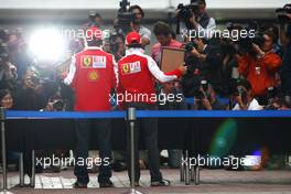 23.10.2010 Yeongam, Korea,  Fernando Alonso (ESP), Scuderia Ferrari, Felipe Massa (BRA), Scuderia Ferrari, hand printing session - Formula 1 World Championship, Rd 17, Korean Grand Prix, Saturday