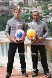 12.05.2010 Monaco, Monte Carlo,  Jenson Button (GBR), McLaren Mercedes, Lewis Hamilton (GBR), McLaren Mercedes with Monaco edition helmets with Steinmetz Diamonds  - Formula 1 World Championship, Rd 6, Monaco Grand Prix, Wednesday