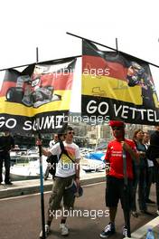 12.05.2010 Monaco, Monte Carlo,  Michael Schumacher (GER), Mercedes GP nd Sebastian Vettel (GER), Red Bull Racing fans - Formula 1 World Championship, Rd 6, Monaco Grand Prix, Wednesday