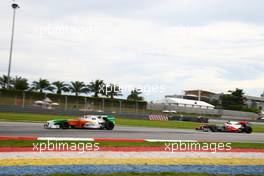 04.04.2010 Kuala Lumpur, Malaysia, Adrian Sutil (GER), Force India F1 Team, VJM-02 leads Lewis Hamilton (GBR), McLaren Mercedes, MP4-25 - Formula 1 World Championship, Rd 3, Malaysian Grand Prix, Sunday Race