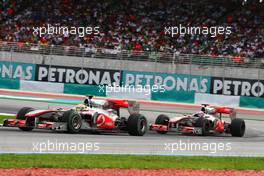 04.04.2010 Kuala Lumpur, Malaysia,  Lewis Hamilton (GBR), McLaren Mercedes, MP4-25 leads Jenson Button (GBR), McLaren Mercedes, MP4-25 - Formula 1 World Championship, Rd 3, Malaysian Grand Prix, Sunday Race