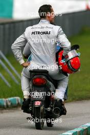 04.04.2010 Kuala Lumpur, Malaysia,  Michael Schumacher (GER), Mercedes GP stops on track  because of a wheel technical problem - Formula 1 World Championship, Rd 3, Malaysian Grand Prix, Sunday Race