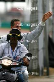 04.04.2010 Kuala Lumpur, Malaysia,  Michael Schumacher (GER), Mercedes GP stops on track  because of a wheel technical problem - Formula 1 World Championship, Rd 3, Malaysian Grand Prix, Sunday Race