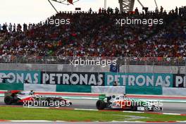 04.04.2010 Kuala Lumpur, Malaysia, Adrian Sutil (GER), Force India F1 Team, VJM-02 leads Lewis Hamilton (GBR), McLaren Mercedes, MP4-25 - Formula 1 World Championship, Rd 3, Malaysian Grand Prix, Sunday Race