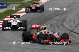 04.04.2010 Kuala Lumpur, Malaysia,  Lewis Hamilton (GBR), McLaren Mercedes, MP4-25 leads Kamui Kobayashi (JAP), BMW Sauber F1 Team, C29 - Formula 1 World Championship, Rd 3, Malaysian Grand Prix, Sunday Race