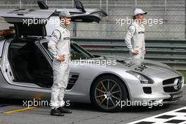 01.04.2010 Kuala Lumpur, Malaysia,  Michael Schumacher (GER), Mercedes GP and Nico Rosberg (GER), Mercedes GP with the safety car  - Formula 1 World Championship, Rd 3, Malaysian Grand Prix, Thursday