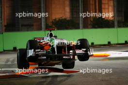 24.09.2010 Singapore, Singapore,  Adrian Sutil (GER), Force India F1 Team gets airbourne after hitting the chicane - Formula 1 World Championship, Rd 15, Singapore Grand Prix, Friday Practice