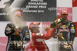 26.09.2010 Singapore, Singapore,  Sebastian Vettel (GER), Red Bull Racing with 1st place Fernando Alonso (ESP), Scuderia Ferrari and Mark Webber (AUS), Red Bull Racing - Formula 1 World Championship, Rd 15, Singapore Grand Prix, Sunday Podium