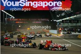 26.09.2010 Singapore, Singapore,  Fernando Alonso (ESP), Scuderia Ferrari leads the start of the race - Formula 1 World Championship, Rd 15, Singapore Grand Prix, Sunday Race