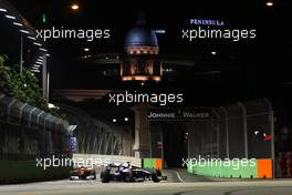 26.09.2010 Singapore, Singapore,  Rubens Barrichello (BRA), Williams F1 Team, FW32 leads Felipe Massa (BRA), Scuderia Ferrari, F10 - Formula 1 World Championship, Rd 15, Singapore Grand Prix, Sunday Race