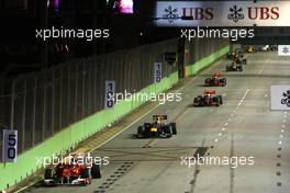 26.09.2010 Singapore, Singapore,  Fernando Alonso (ESP), Scuderia Ferrari, F10 leads Rubens Barrichello (BRA), Williams F1 Team, FW32 at the start of the race - Formula 1 World Championship, Rd 15, Singapore Grand Prix, Sunday Race