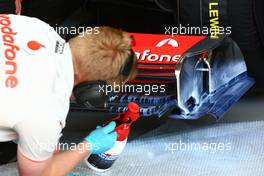 28.05.2010 Istanbul, Turkey,  McLaren Mercedes  mechanic use painting to work on aero - Formula 1 World Championship, Rd 7, Turkish Grand Prix, Friday Practice