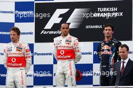 30.05.2010 Istanbul, Turkey,  1st place Lewis Hamilton (GBR), McLaren Mercedes with 2nd place Jenson Button (GBR), McLaren Mercedes and 3rd place Mark Webber (AUS), Red Bull Racing - Formula 1 World Championship, Rd 7, Turkish Grand Prix, Sunday Podium
