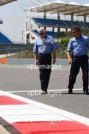 27.05.2010 Istanbul, Turkey,  Charlie Whiting (GBR), FIA Safty delegate, Race director & offical starter inspects the circuit - Formula 1 World Championship, Rd 7, Turkish Grand Prix, Thursday