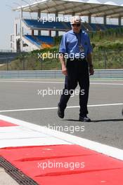 27.05.2010 Istanbul, Turkey,  Charlie Whiting (GBR), FIA Safty delegate, Race director & offical starter inspects the circuit - Formula 1 World Championship, Rd 7, Turkish Grand Prix, Thursday