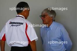 27.05.2010 Istanbul, Turkey,  Hiroshi Yasukawa (JPN) Bridgestone Director of Motorsport with Bernie Ecclestone (GBR) CEO Formula One Group  - Formula 1 World Championship, Rd 7, Turkish Grand Prix, Thursday