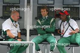 12.11.2010 Abu Dhabi, Abu Dhabi,  Mike Gascoyne (GBR), Lotus F1 Team, Chief Technical Officer with Jarno Trulli (ITA), Lotus F1 Team and Tony Fernandes, Lotus F1 Team, Team Principal - Formula 1 World Championship, Rd 19, Abu Dhabi Grand Prix, Friday Practice