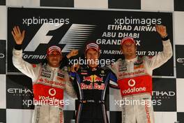 14.11.2010 Abu Dhabi, Abu Dhabi,  2nd place Lewis Hamilton (GBR), McLaren Mercedes with New world Champion and 1st place Sebastian Vettel (GER), Red Bull Racing and 3rd place Jenson Button (GBR), McLaren Mercedes - Formula 1 World Championship, Rd 19, Abu Dhabi Grand Prix, Sunday Podium