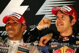 14.11.2010 Abu Dhabi, Abu Dhabi,  Lewis Hamilton (GBR), McLaren Mercedes and Sebastian Vettel (GER), Red Bull Racing  - Formula 1 World Championship, Rd 19, Abu Dhabi Grand Prix, Sunday Podium